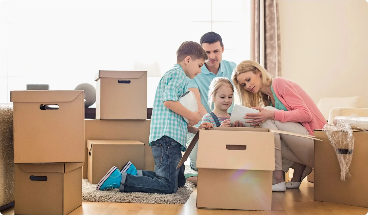 cardboard-boxes Family unboxing after moving