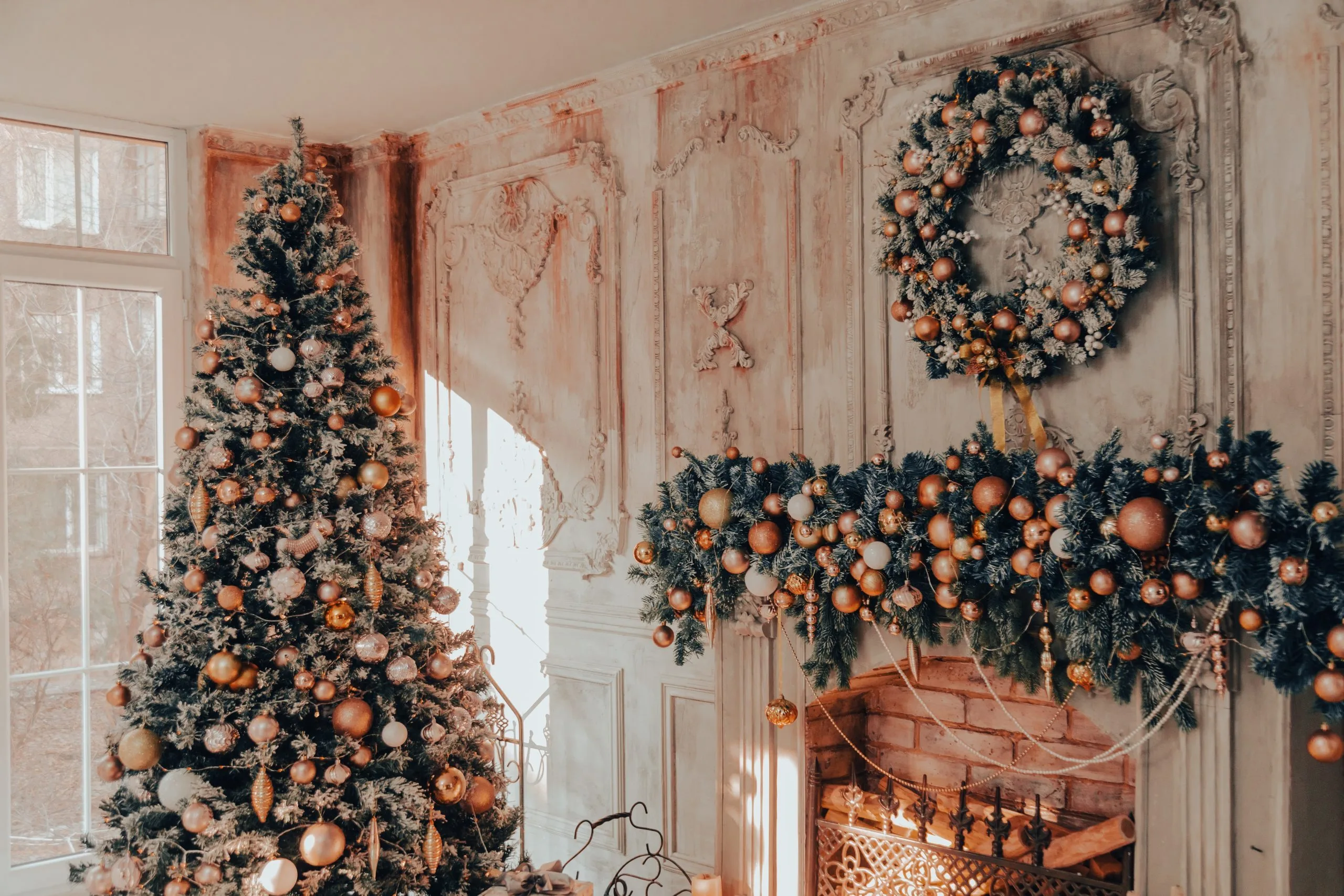 collab-media-RzUEcwpIOiY-unsplash Living-room and fireplace being decorated for Christmas