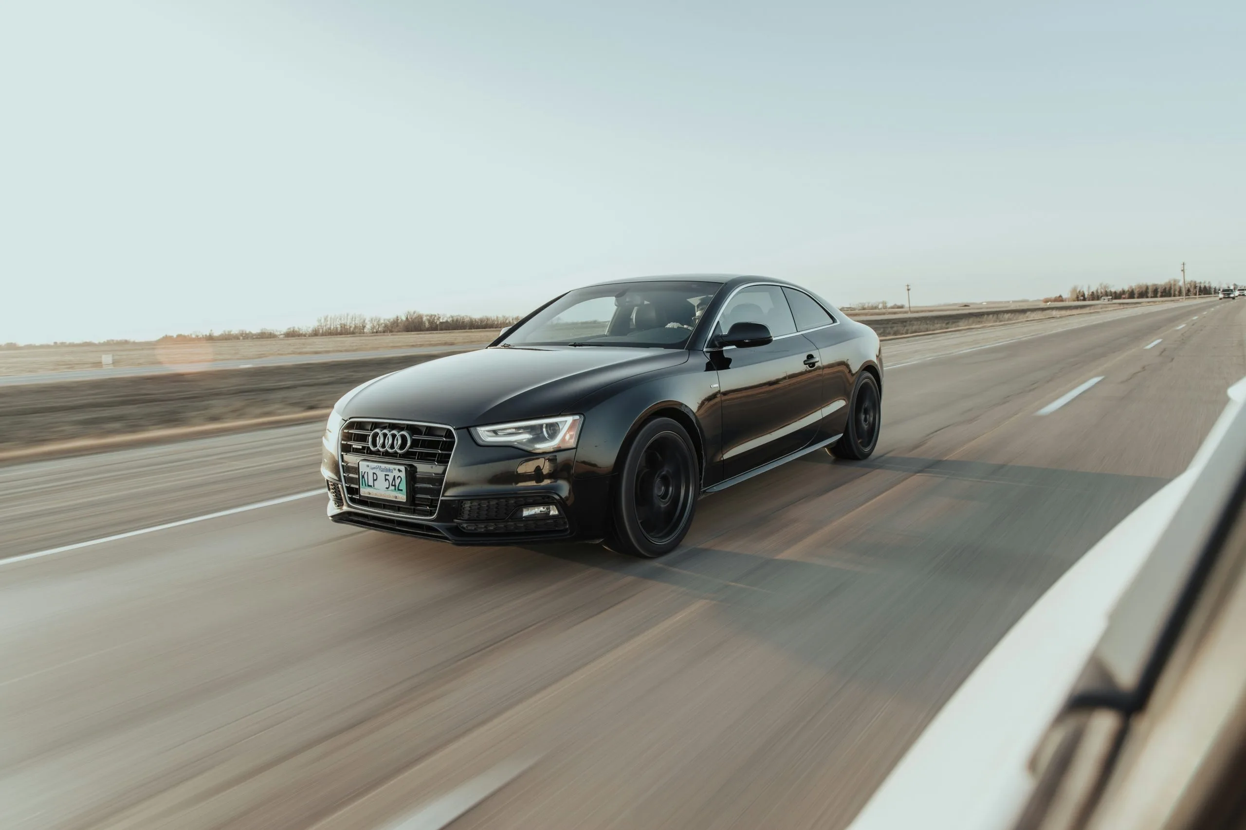 miles-loewen-a0SRjVsk7Jg-unsplash Audie driving on the road