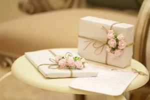 Gifts on table with flowers on them
