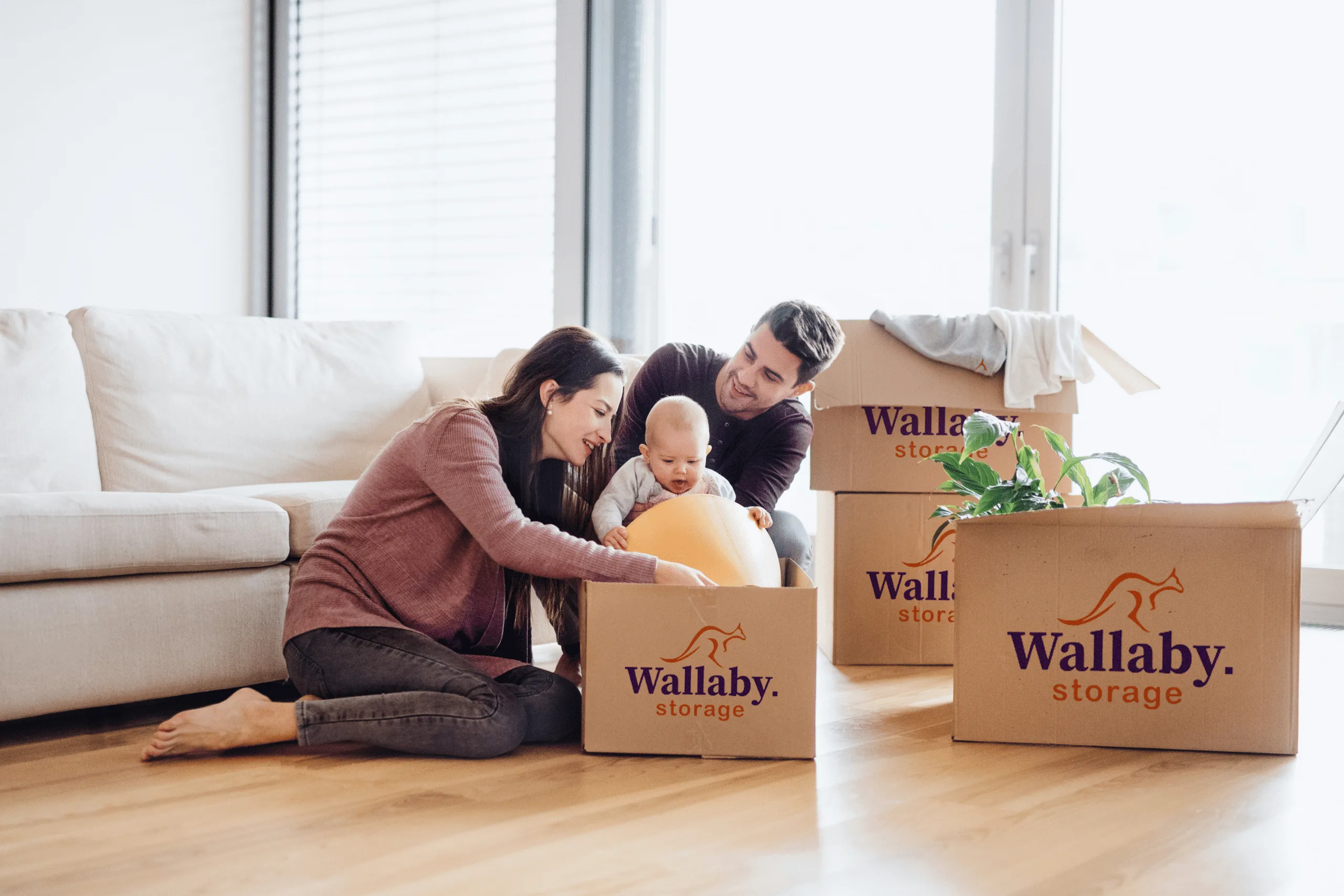 Family using a moving house checklist while packing for a Melbourne relocation.